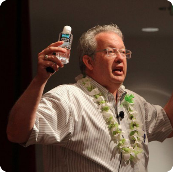 Dr Paul White holding a bottle