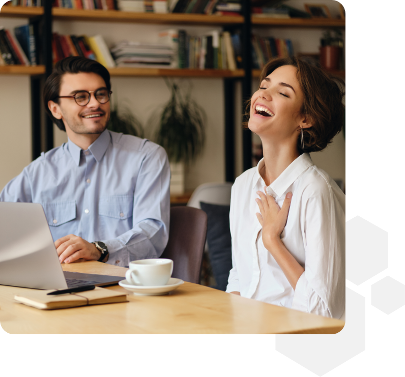 Two office workers smiling