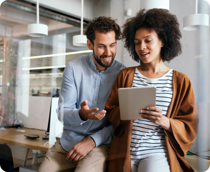 Two people sharing a tablet