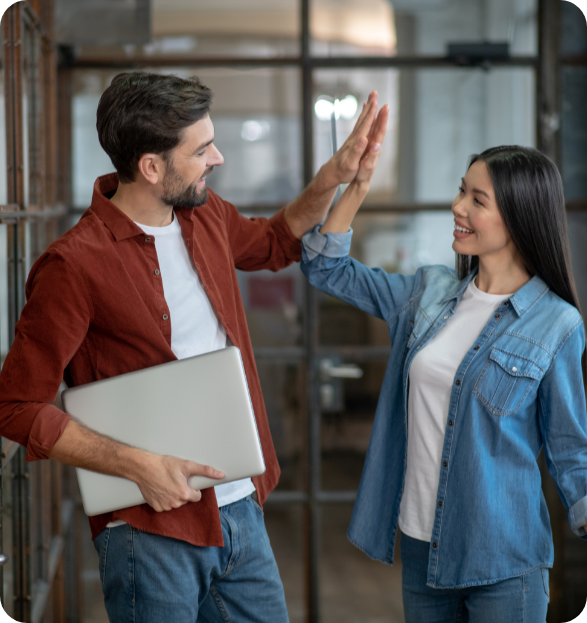 Young Girl doing a high-five with her colleague