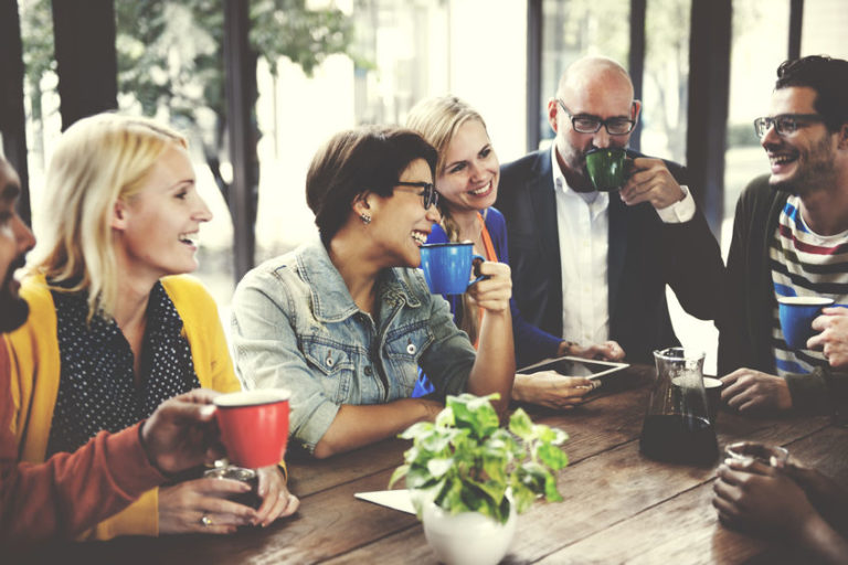 Companions drinking together around a table